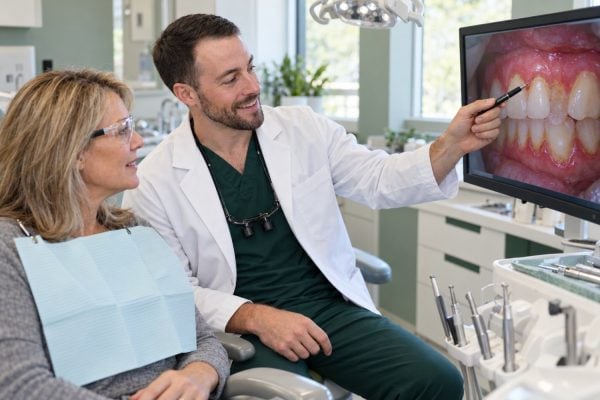 Dr. Andrew Welles explaining gum health on an intraoral photo